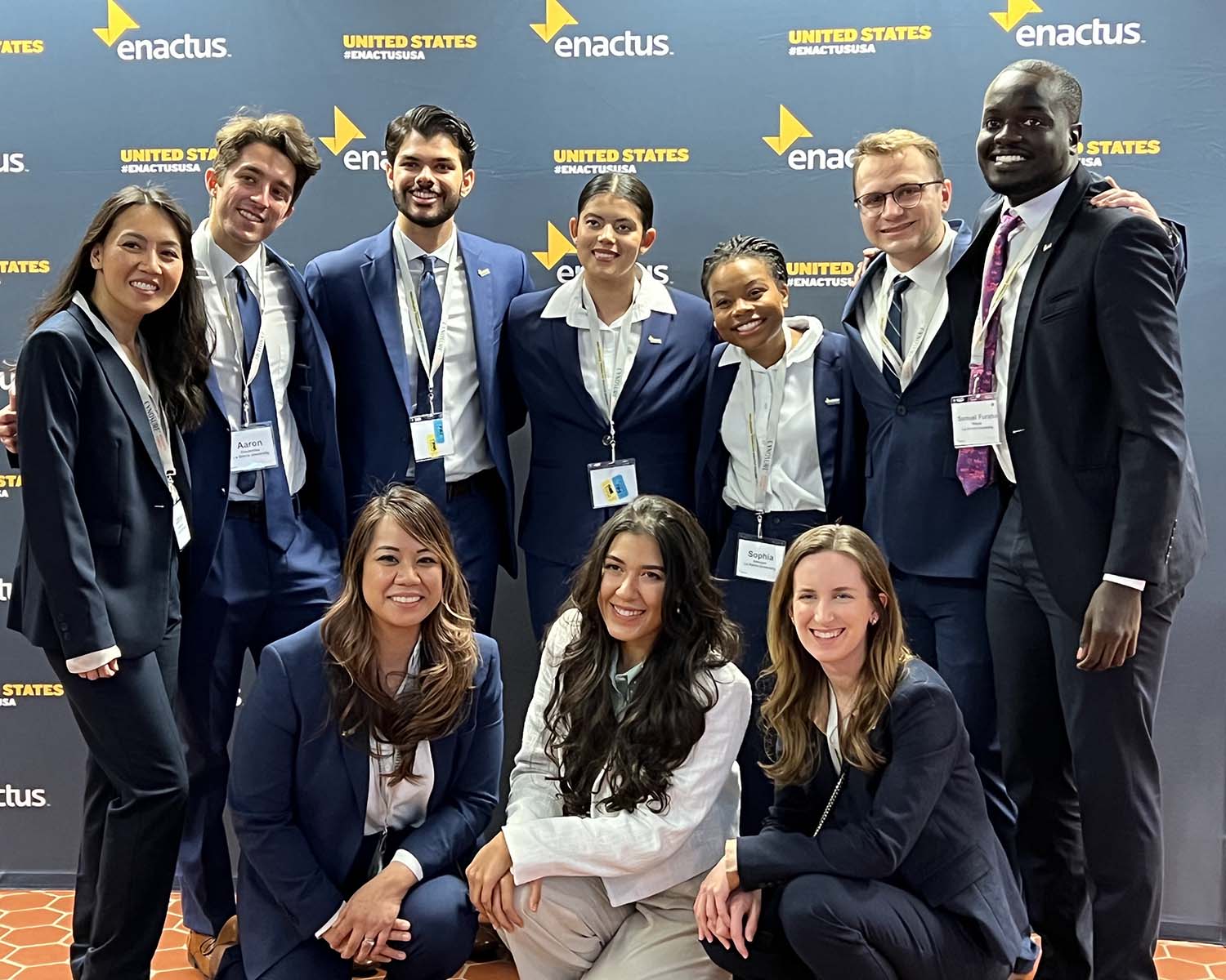 Mixed group of people winning an award