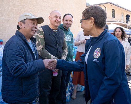 Los Angeles Mayor Karen Bass, left, interacts with volunteers during the January 12 outreach event organized by the Southern California Conference toward helping those impacted by wildfires. Photo provided by the Southern California Conference