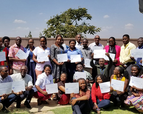 Participants of the three-day training on “Assisting Individuals in Crisis” display their certificates of completion.  