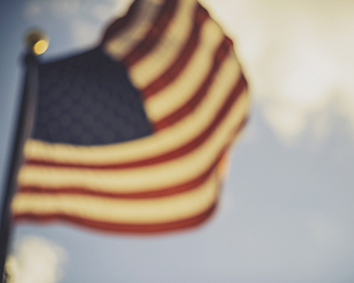 American flag blowing in the wind.