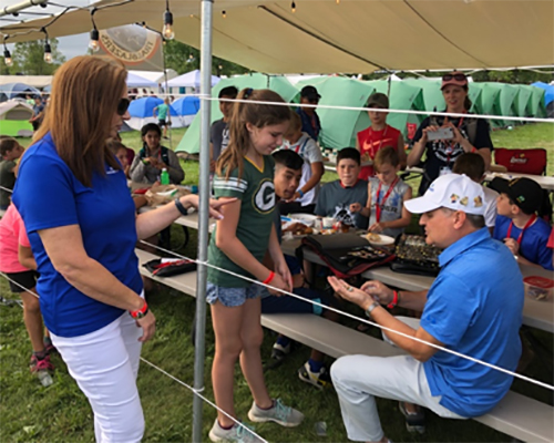 AdventHealth president/CEO Terry Shaw trades pins at 2019 Oshkosh Camporee