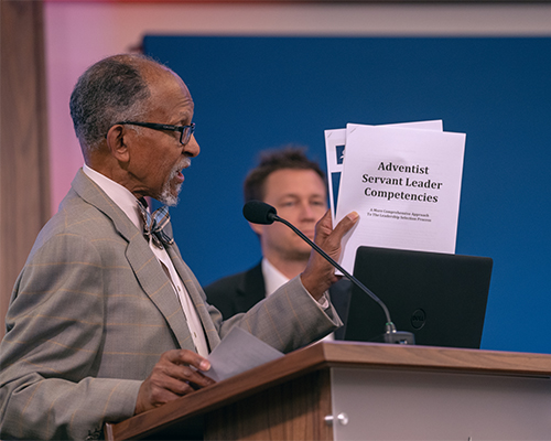 Alvin Kibble, NAD vice president for Big Data + Social Media, Public Affairs and Religious Liberty, Literature Ministries, and Executive Coaching, Training, and Development, holds a report on core competencies that can be used to evaluate candidates for church leadership roles.