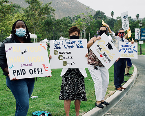 Faculty and staff of the School of Education cheer on La Sierra’s graduates.