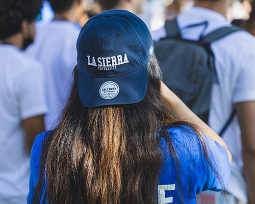 La Sierra University student with hat on