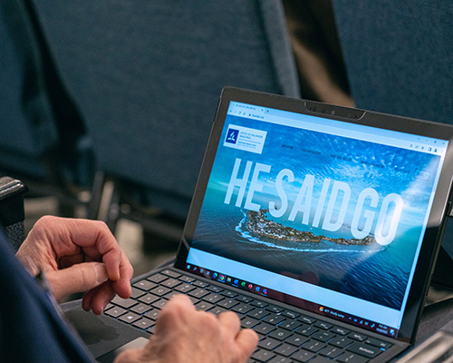 He Said Go OVM screen on laptop at 2022 YEM