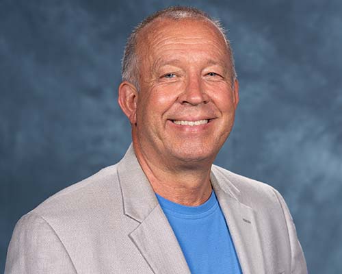 Arne Nielsen (middle aged caucasian man, white hair), NAD education VP, passes away on June 3