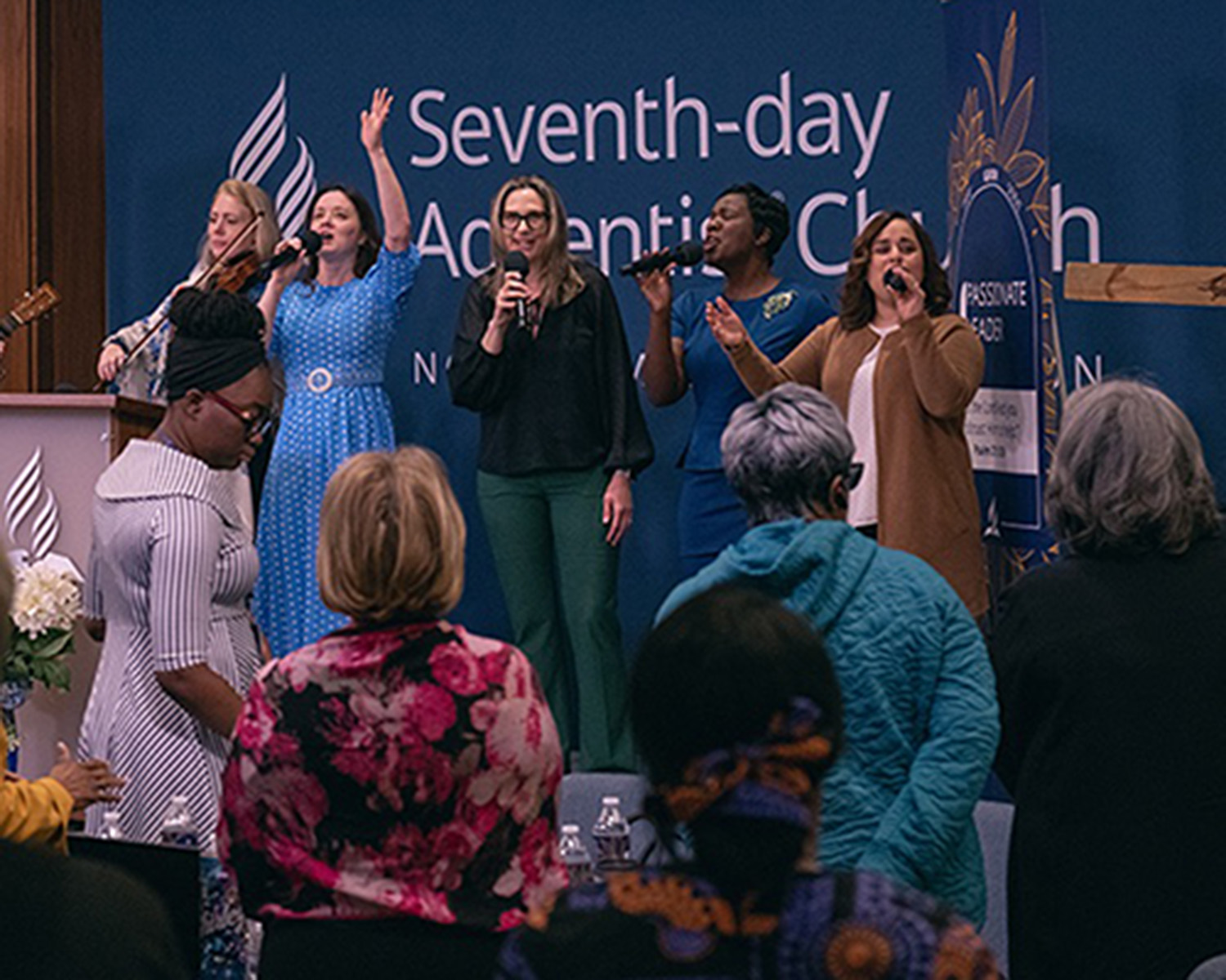 Group of women singing.