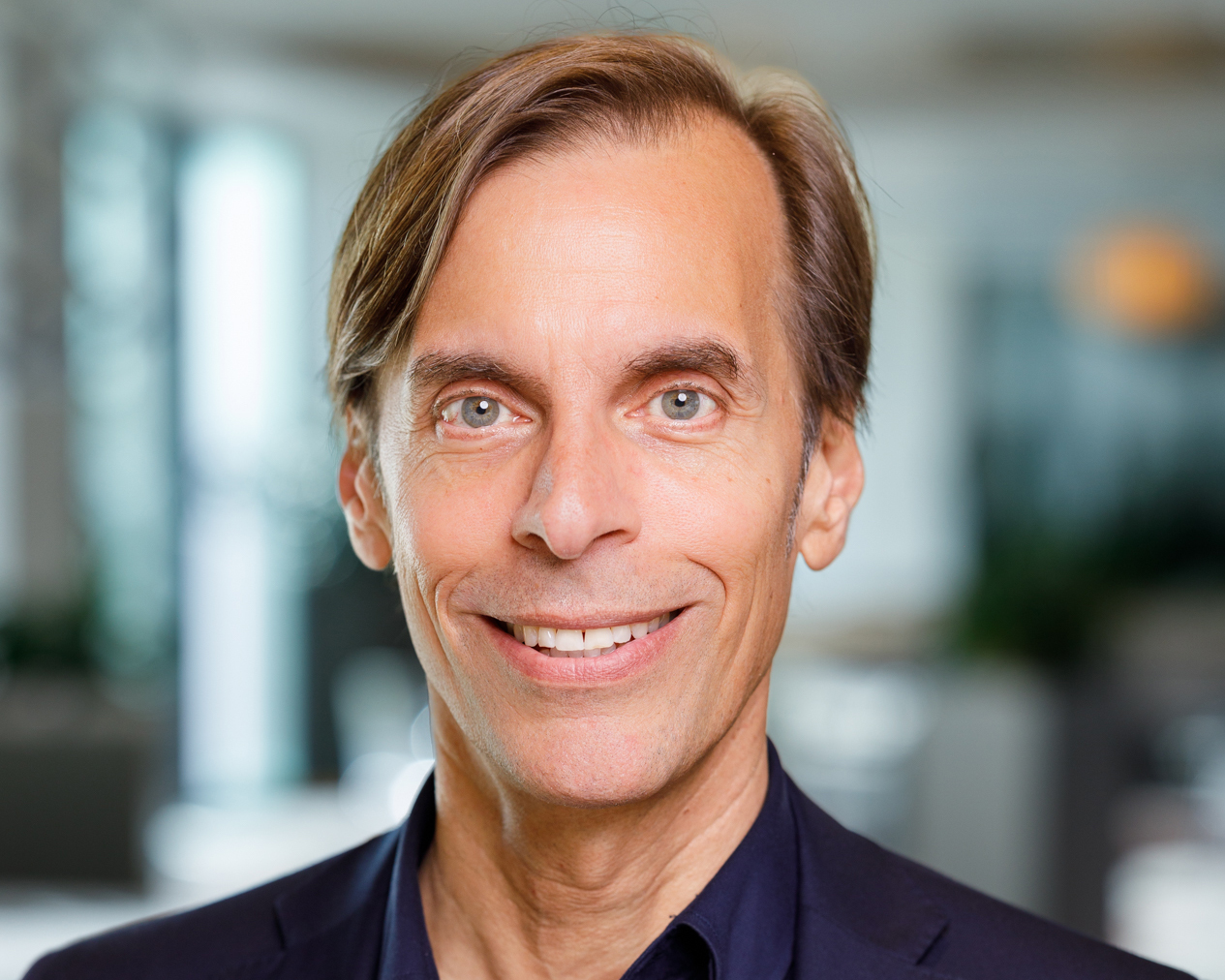 Sam Leonor smiling towards the camera.