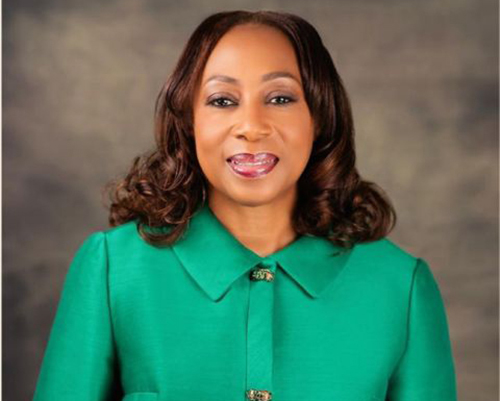 African American woman wearing green top, Gina Spivey-Brown