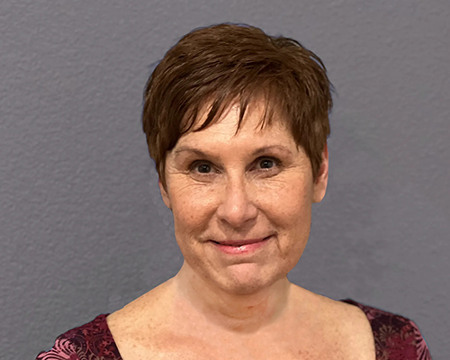 A headshot of a woman