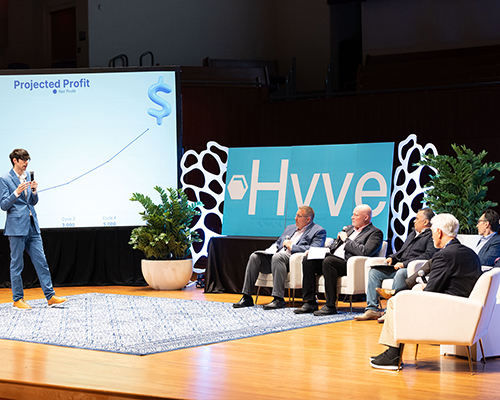 Andrews University auditorium with business student and listening panel