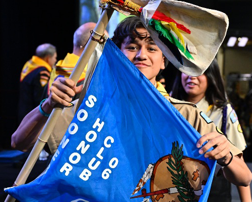 Pathfinder proudly holds up flag during PBE event.