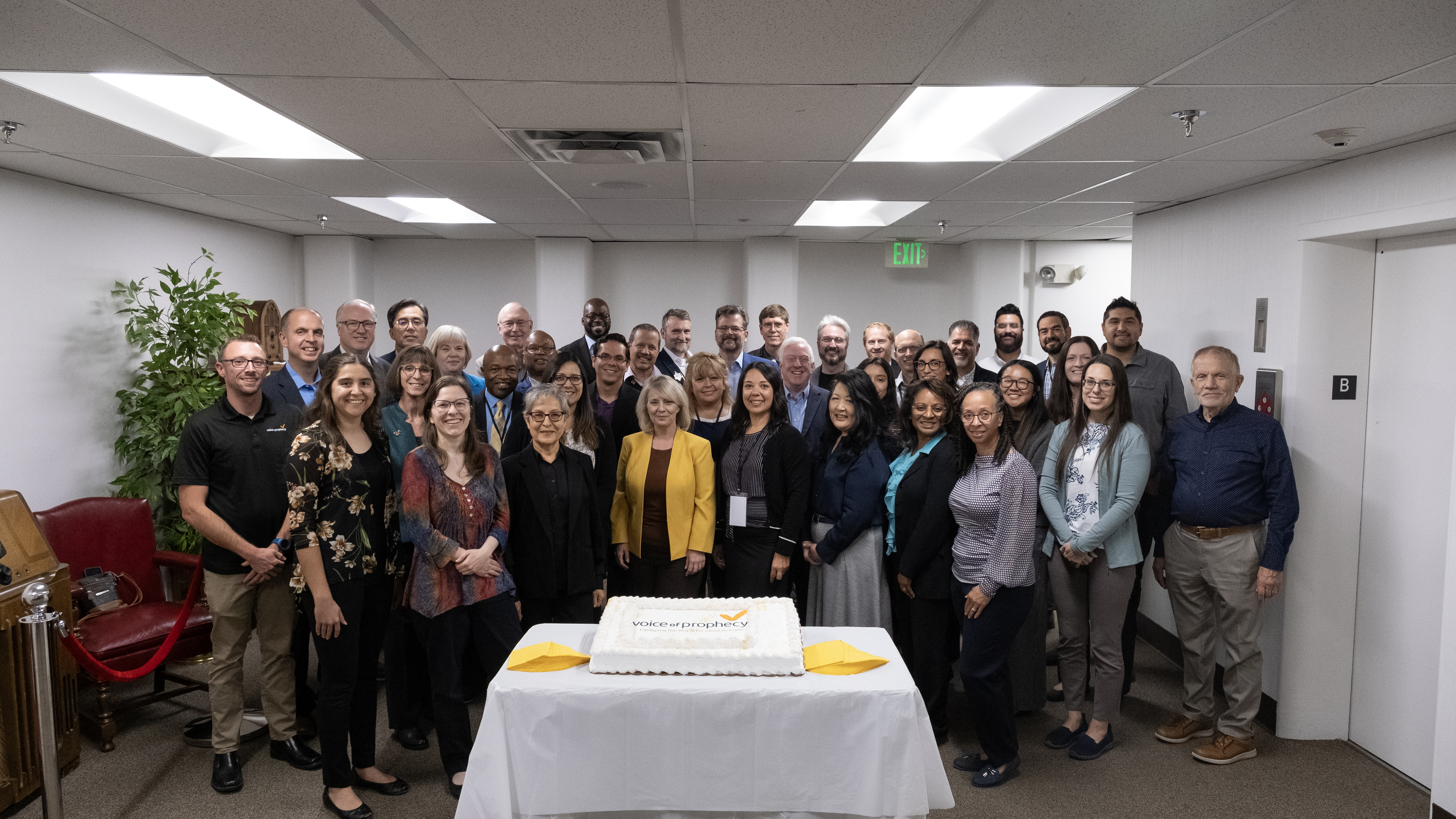 The Voice of Prophecy team gathers with their executive committee to celebrate the ministry’s upcoming 95th birthday.&nbsp;In September, the committee visited the ministry’s office in Loveland, Colorado, and several partook of a birthday cake.