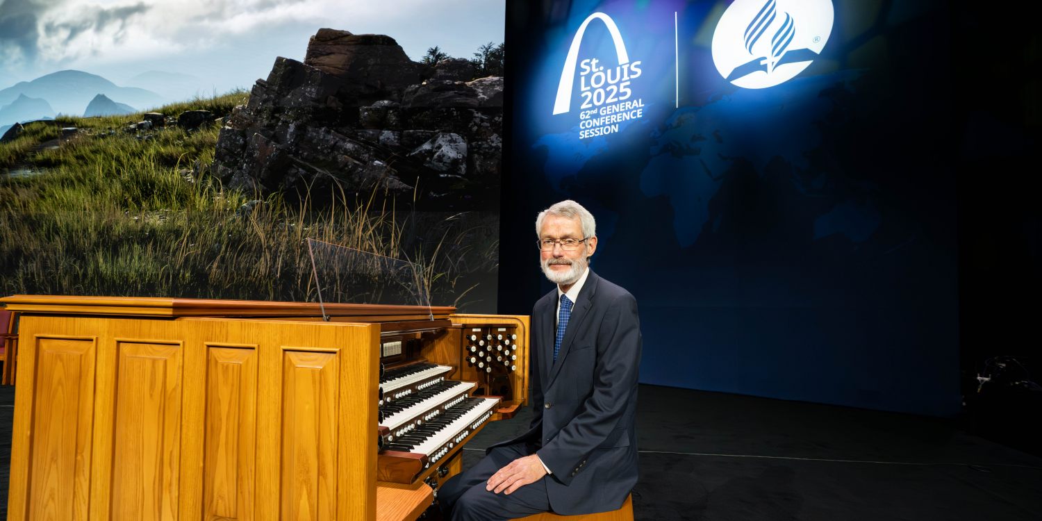 Ken Logan sits at the Organ.