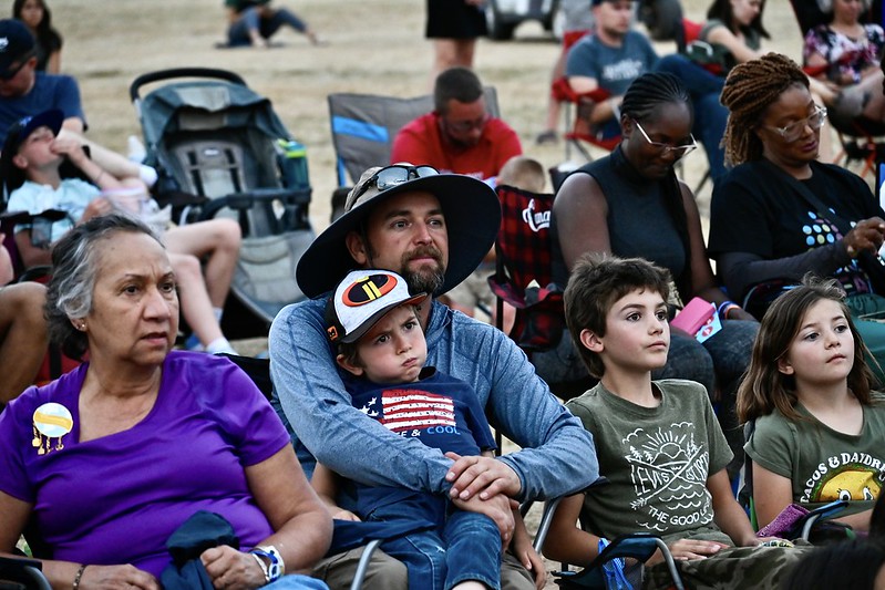 Throughout the 2024 camporee, an appreciative audience enjoyed the skillful performances of actors bringing the story of Moses to life. Pictured are community members at a special preview of the evening programming on Sunday, August 4.