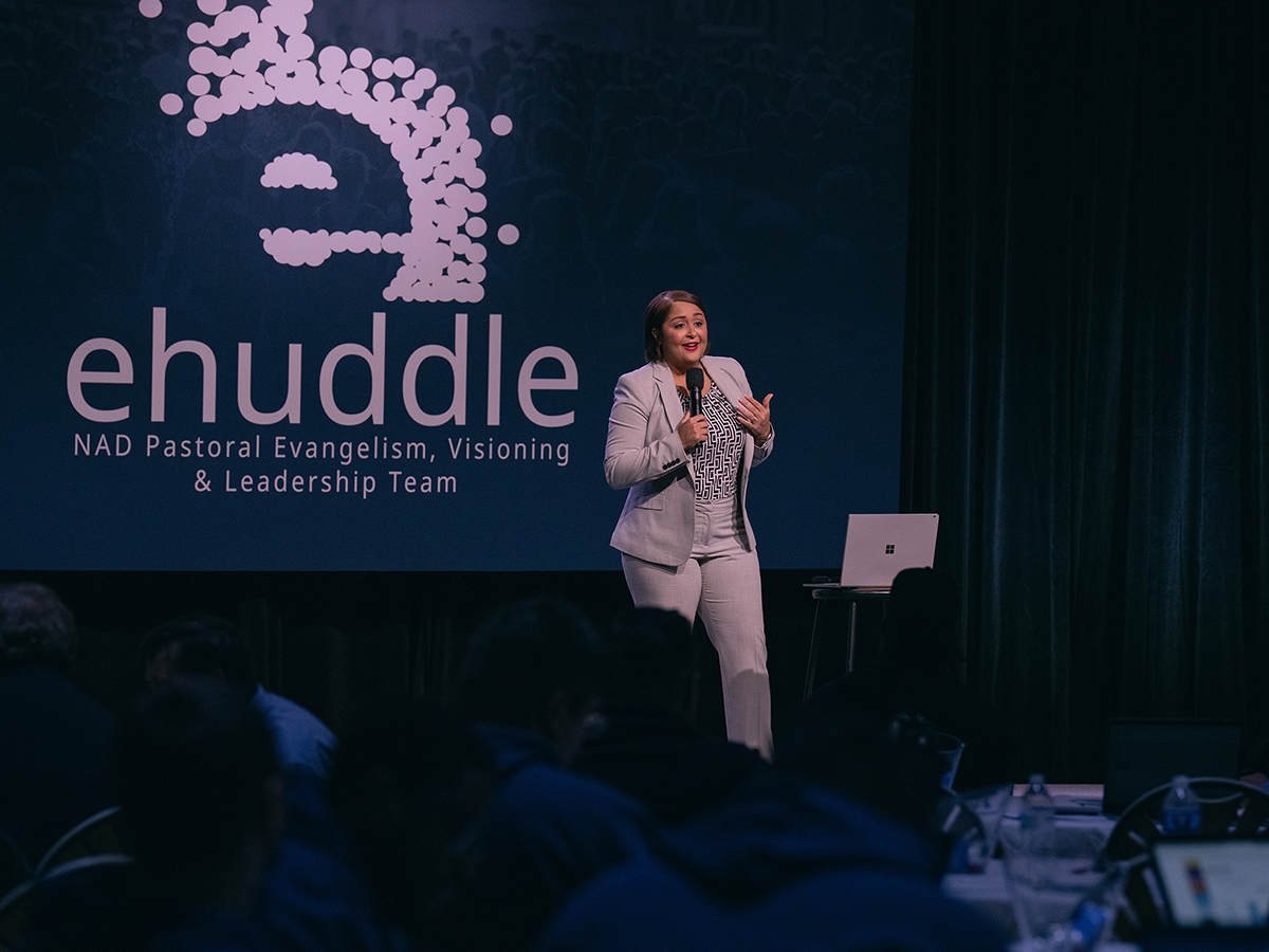 Hispanic woman speaking on a stage