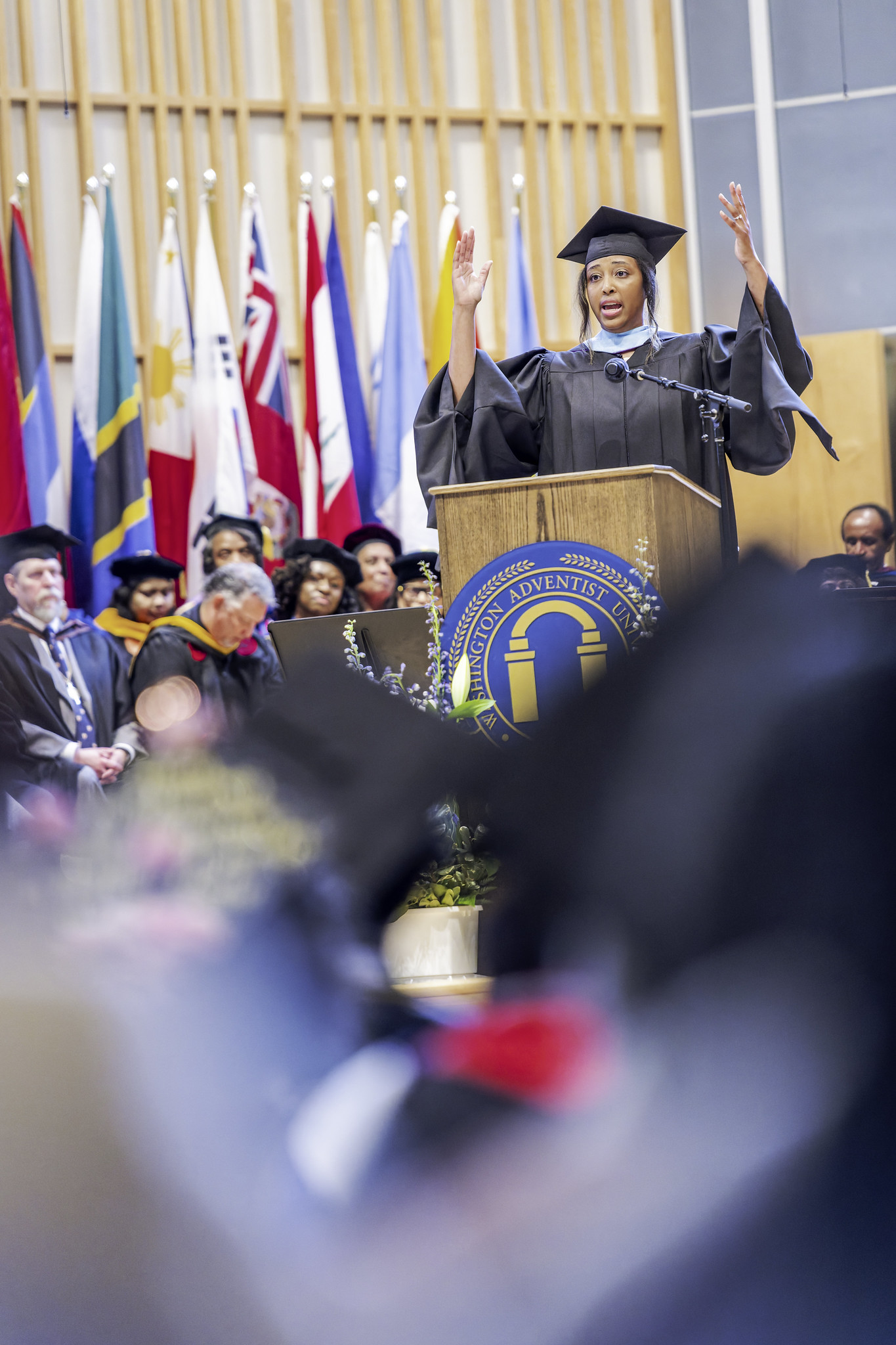 Graduate gives speech at Washington Adventist University Graduation.