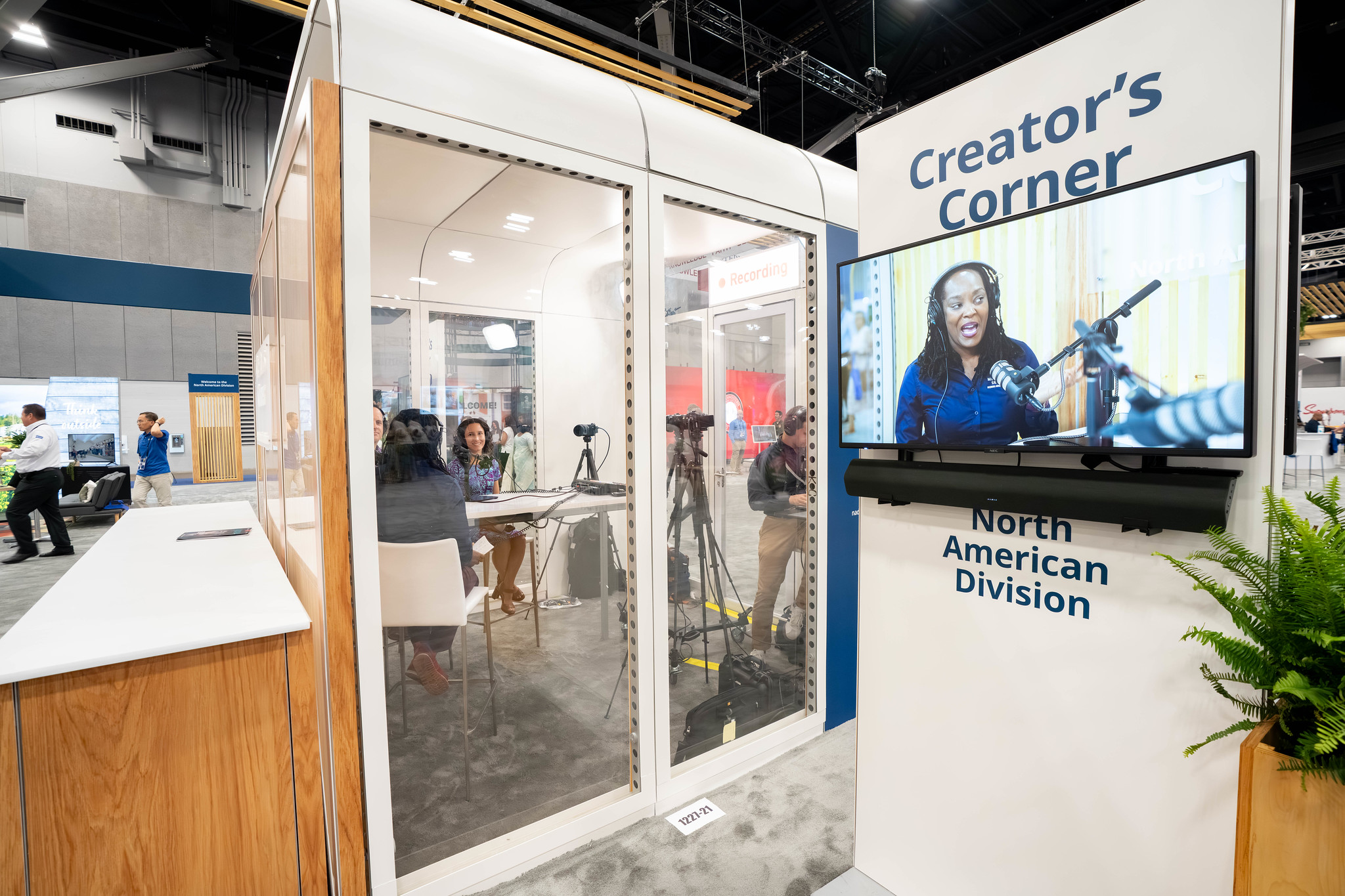A women is shown on a TV live from the "Creator's Corner" studio space.