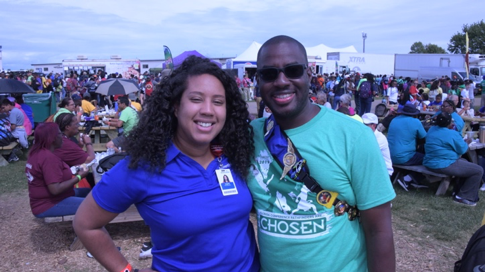Juleun Johnson, director of mission and ministry for AdventHealth Celebration, shows off his pins, including the AdventHealth #40 racecar. Photo provided by AdventHealth