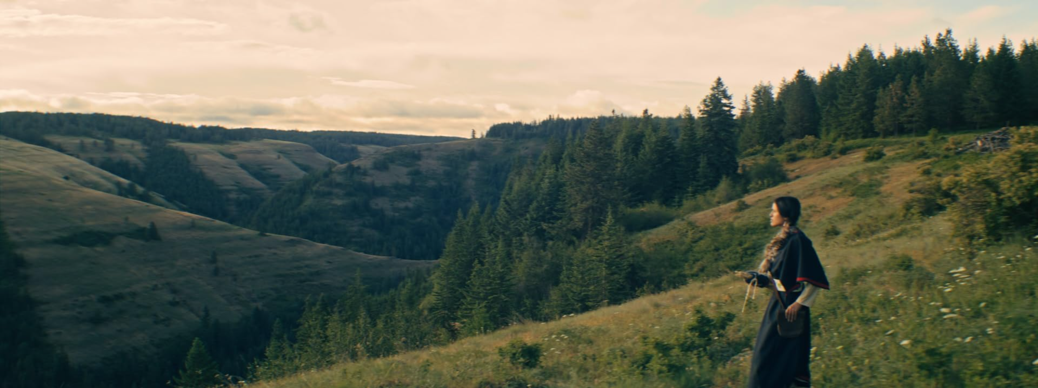 Native American woman in Oregon meadow on mountainside in 1990s attire