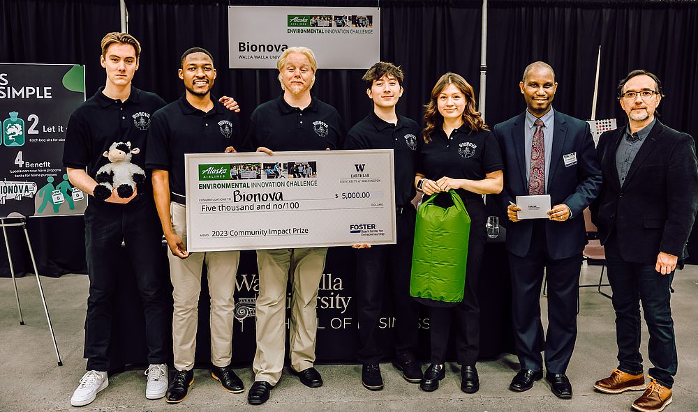 Walla Walla University Enactus Club team poses with the community impact prize they earned for their energy innovation project Bionova, a biogas production process.
