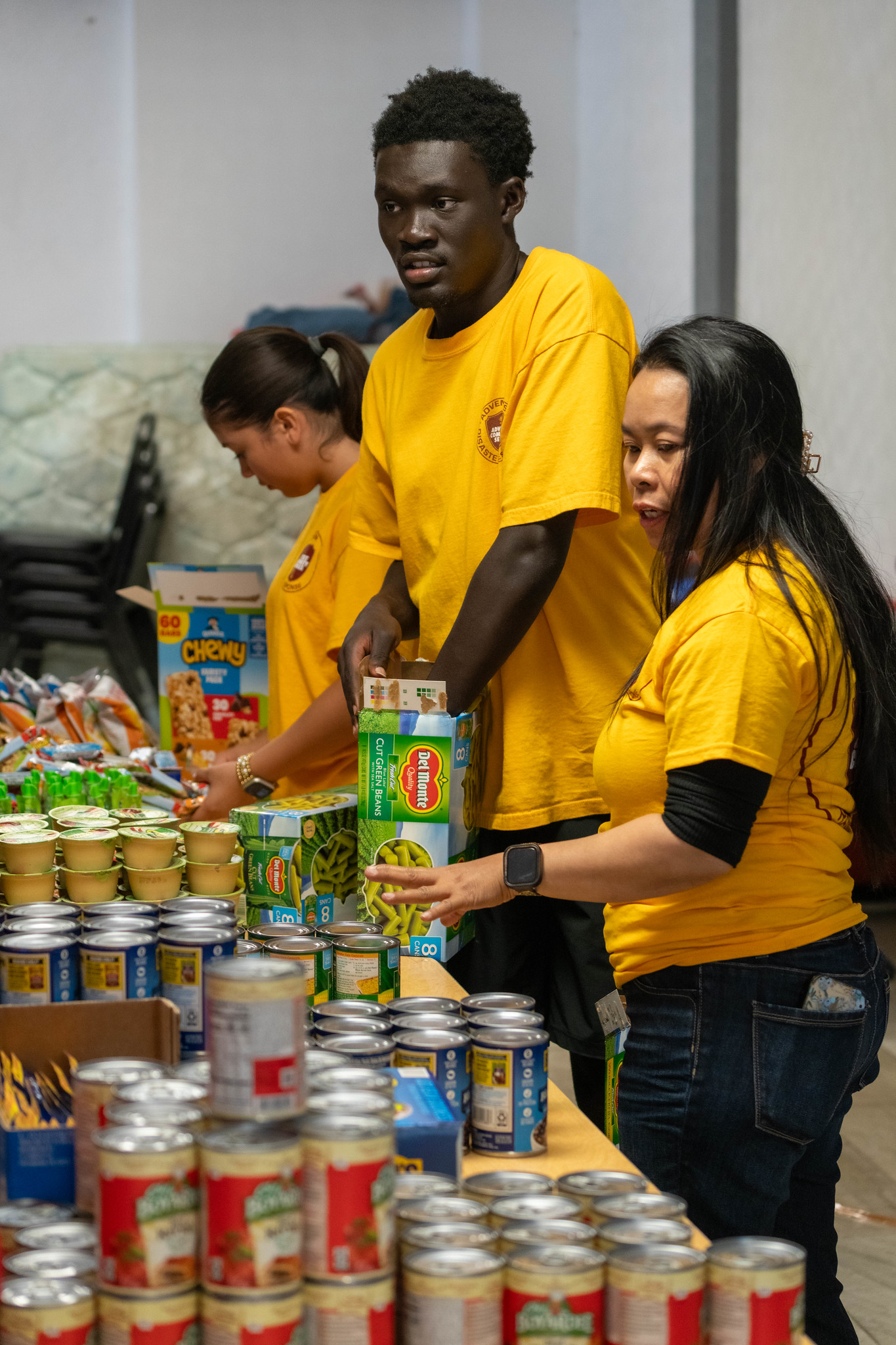 ACS youth volunteers get the food inventory in order in preparation for tornado victims stopping by to attain some much-needed essentials.