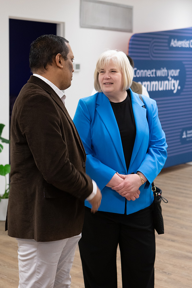 Judy Glass (caucasian middle aged woman) and finance person