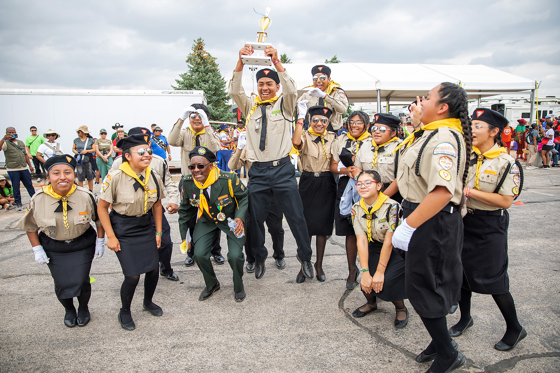 Diverse Patfhinder drill team celebrating after a win
