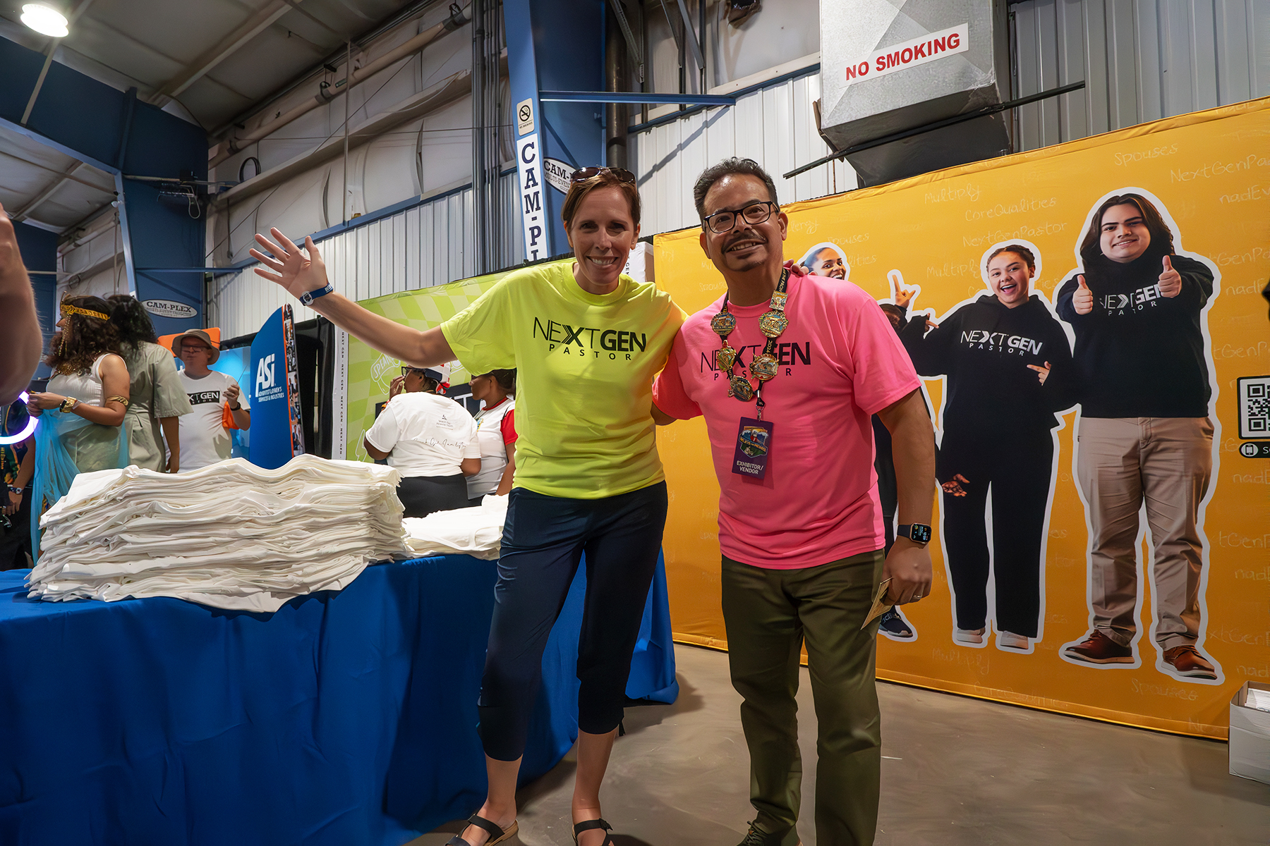 The NextGen Pastor booth at the Believe the Promise International Pathfinder Camporee in Gillette Wyoming. Pictured are Jose Cortes Jr., NAD Ministerial associate director, and Paola Oudri, associate director, Adventist Learning Community. Photo : Art Brondo | North American Division