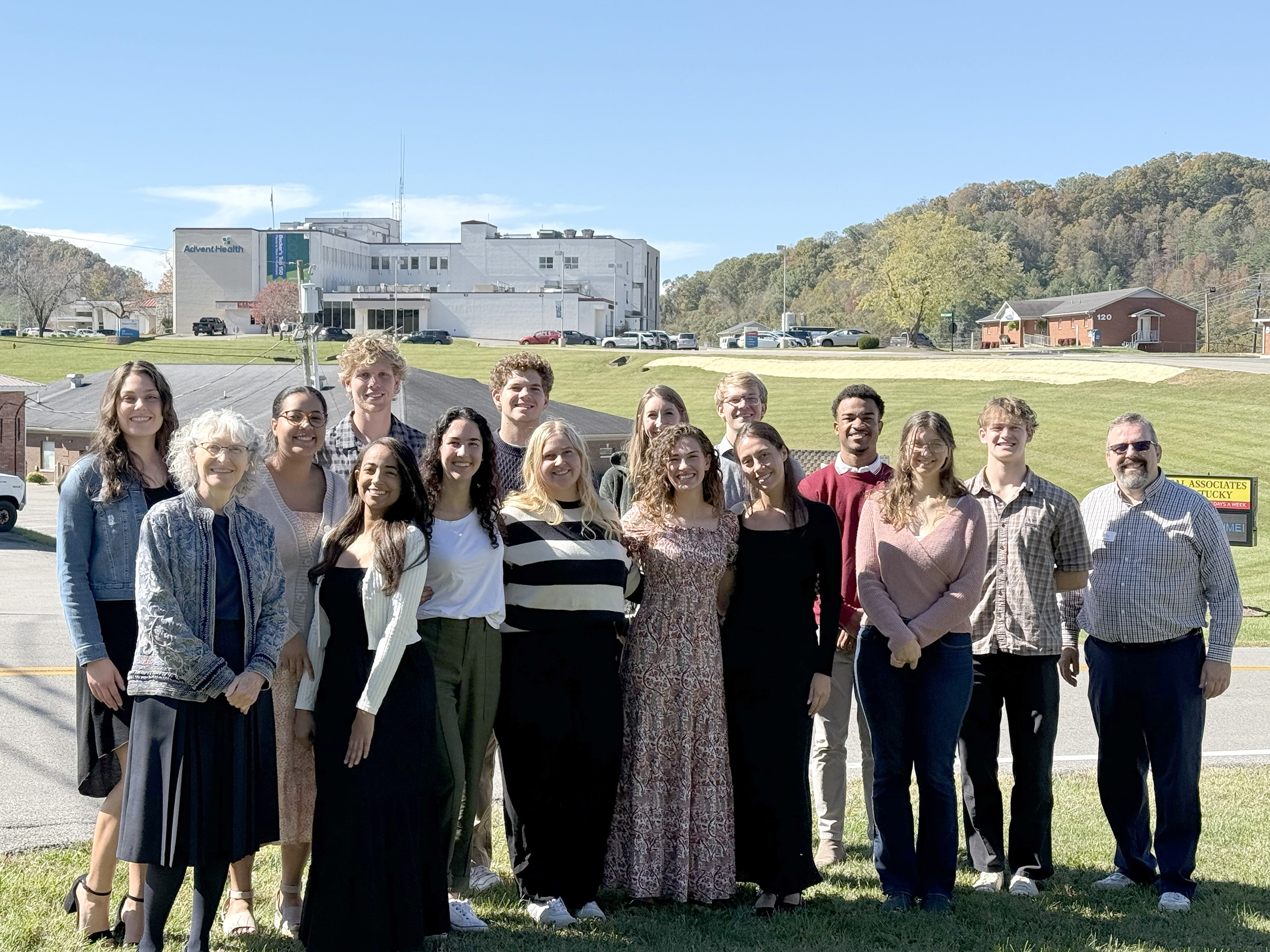 The 14 students and faculty post for a photo during their trip.