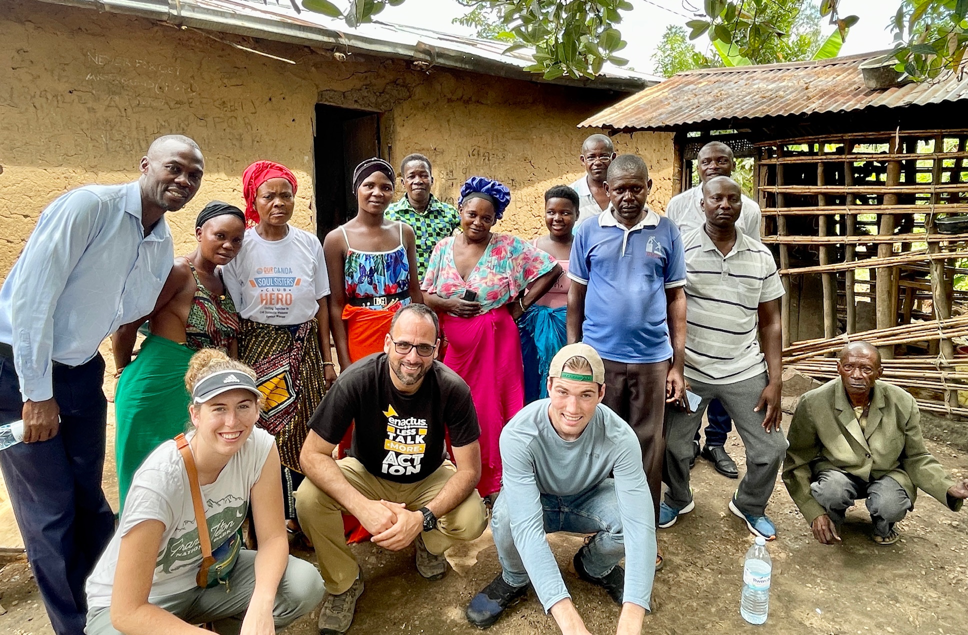 Students and Professor Sergio Bellino pose with the church members in Uganda.