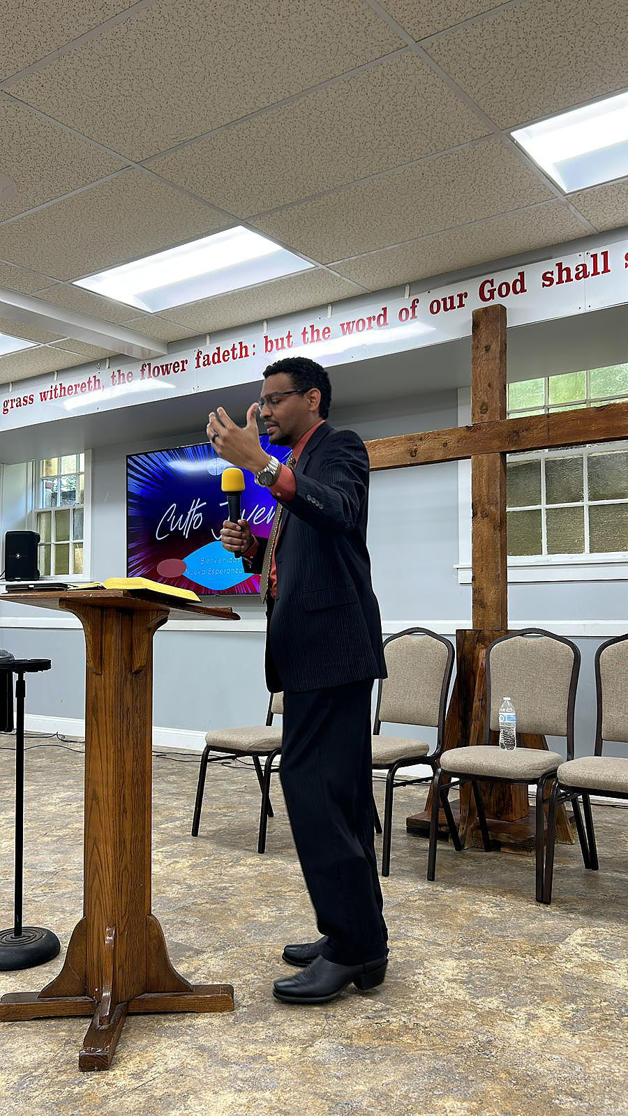 Man preaching behind a podium